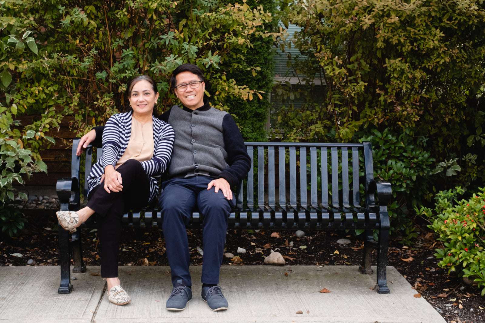 Two people sitting together on a park bench